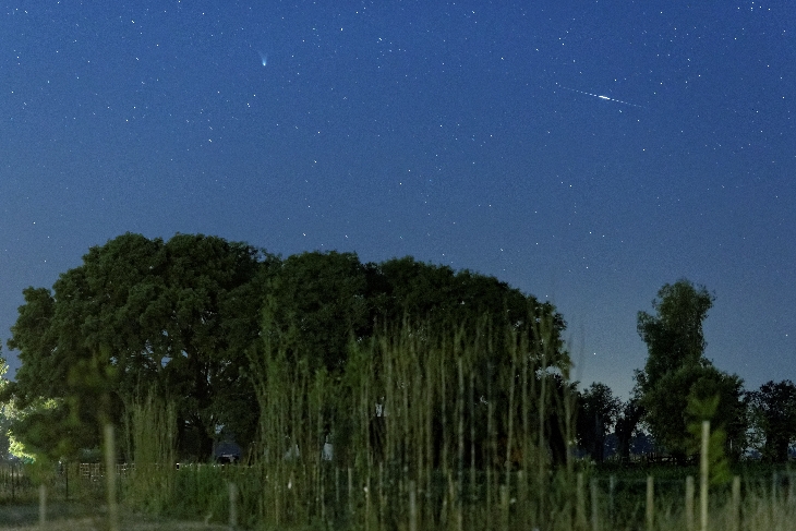 Comet PanSTARRS is the smear on the left. The dotted line on the right is an Iridium satellite.