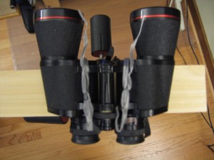 Binocular Mount W Loop the fasteners around the middle of the binocs, and under the bottom of the support